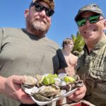 Enjoying fresh oysters during Nayarit Mexico duck hunt