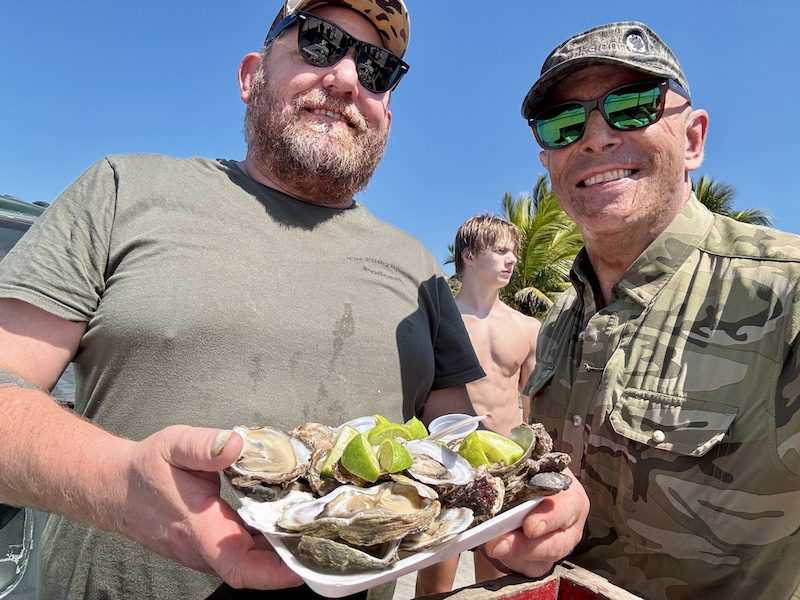 Enjoying fresh oysters during Nayarit Mexico duck hunt